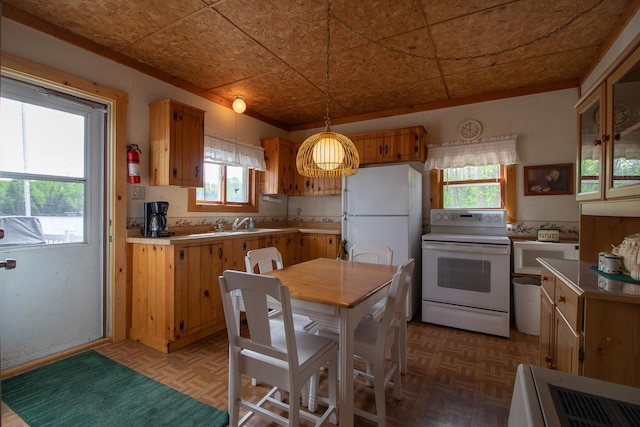7528 Little Thunder Dr NE, Remer, MN 56672 - kitchen with electric stove, decorative light fixtures, light countertops, brown cabinetry, and an ornate ceiling