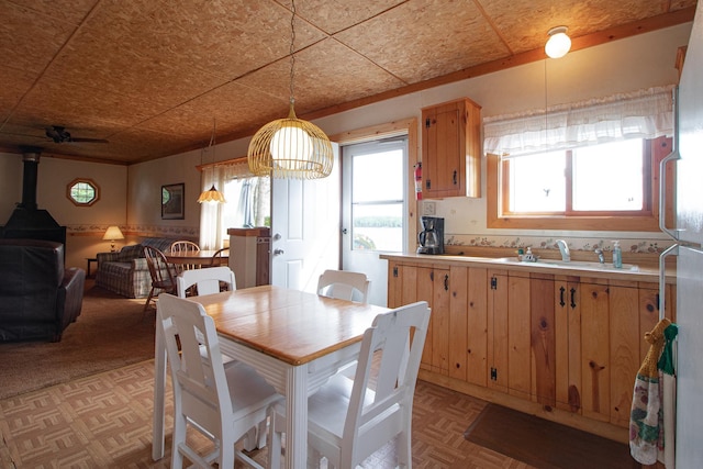 7528 Little Thunder Dr NE, Remer, MN 56672 - dining room featuring a wood stove