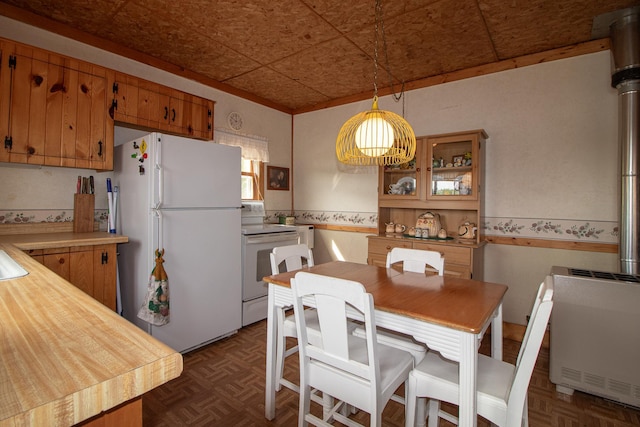 7528 Little Thunder Dr NE, Remer, MN 56672 - dining space with an ornate ceiling, a wainscoted wall, and heating unit