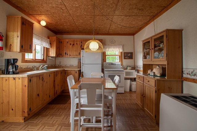 7528 Little Thunder Dr NE, Remer, MN 56672 - kitchen with white appliances, light countertops, a sink, an ornate ceiling, and glass insert cabinets