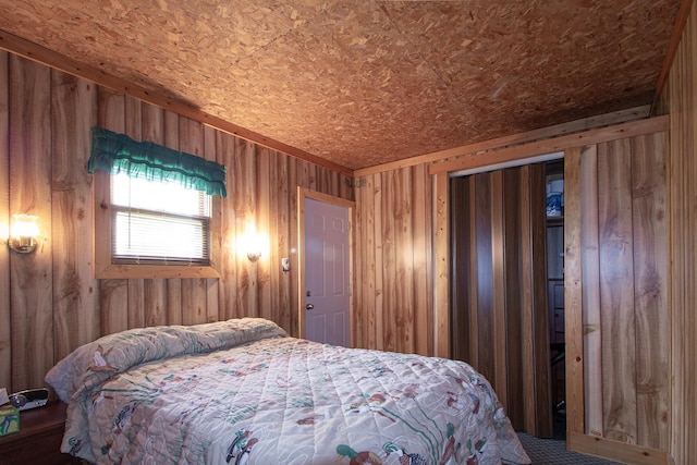 7528 Little Thunder Dr NE, Remer, MN 56672 - bedroom featuring wooden walls and carpet