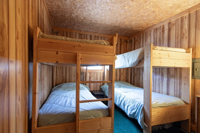 7528 Little Thunder Dr NE, Remer, MN 56672 - bedroom featuring carpet flooring and wood walls