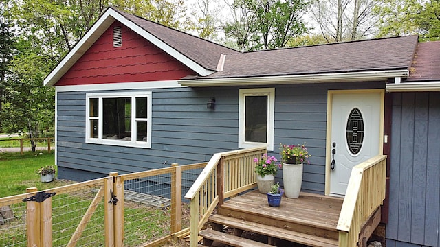 36974 320th St, Aitkin, MN 56431 - view of front of home with roof with shingles and a deck