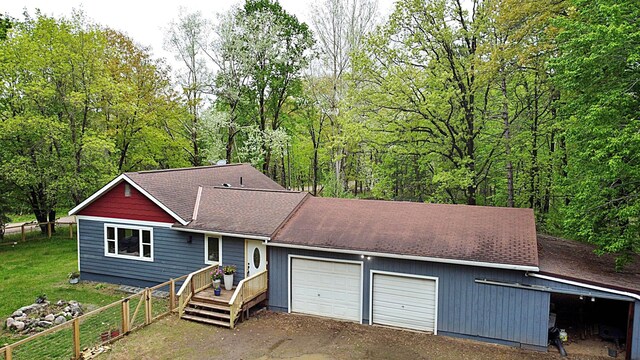 36974 320th St, Aitkin, MN 56431 - view of front of home with a shingled roof and a deck