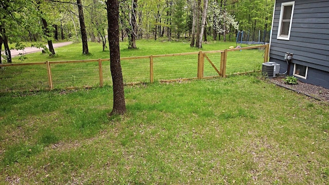 36974 320th St, Aitkin, MN 56431 - view of yard featuring a trampoline and central AC unit