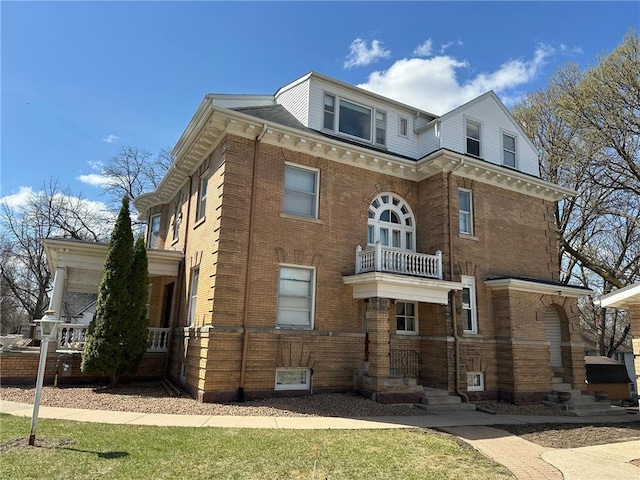 215 5th St S, Montevideo, MN 56265 - view of front facade with brick siding and a balcony