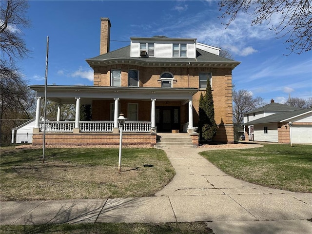 215 5th St S, Montevideo, MN 56265 - view of front facade featuring a porch, brick siding, a front lawn, and a chimney