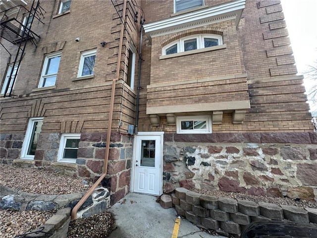 215 5th St S, Montevideo, MN 56265 - view of exterior entry featuring brick siding and stone siding