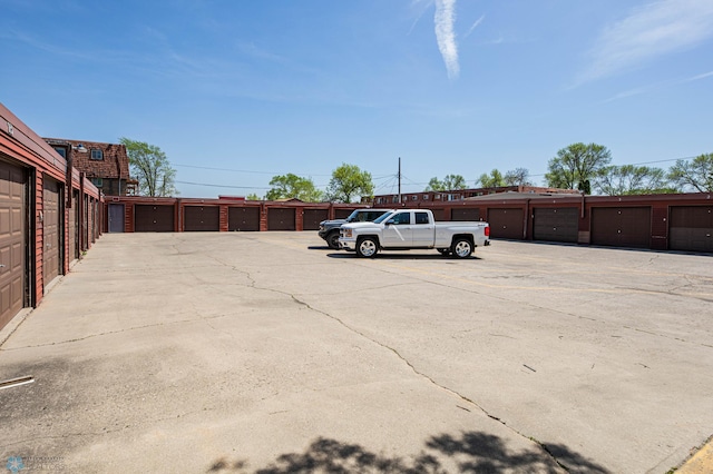 view of vehicle parking with community garages