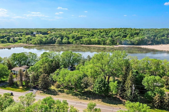aerial view of a heavily wooded area and a large body of water