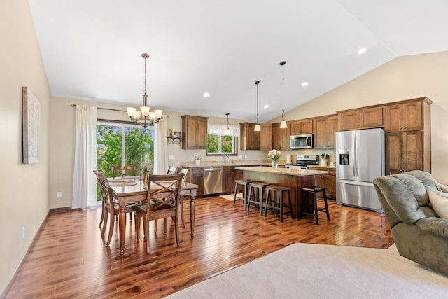 805 Cologne Ln, Waverly, MN 55390 - dining room featuring a chandelier, lofted ceiling, dark wood-style floors, recessed lighting, and baseboards