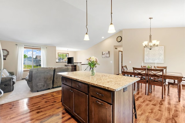 805 Cologne Ln, Waverly, MN 55390 - kitchen with light wood-style flooring, a chandelier, lofted ceiling, open floor plan, and a center island