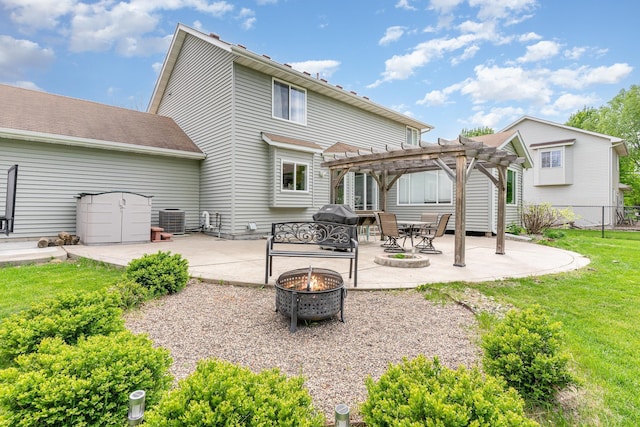 5921 200th St W, Farmington, MN 55024 - back of property with a fire pit, a pergola, and a patio