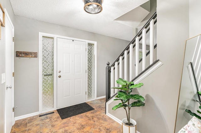 5921 200th St W, Farmington, MN 55024 - foyer entrance with stone finish floors and a textured ceiling