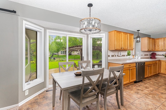 5921 200th St W, Farmington, MN 55024 - dining space with a textured ceiling and a chandelier