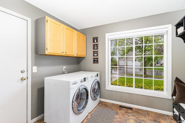 5921 200th St W, Farmington, MN 55024 - laundry room featuring cabinet space, washer and dryer, and dark stone finish floors