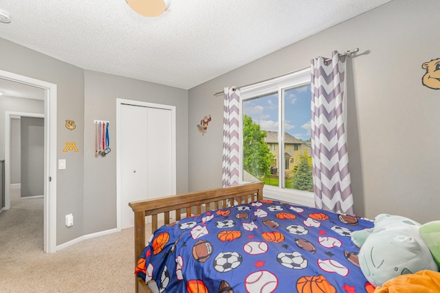 5921 200th St W, Farmington, MN 55024 - carpeted bedroom featuring a closet and a textured ceiling