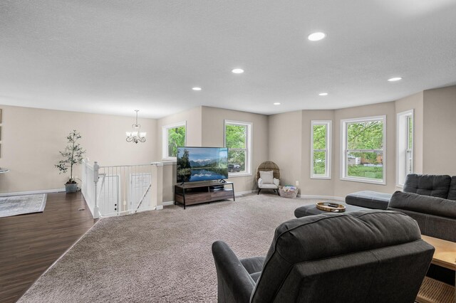 1002 8th Ave N, Princeton, MN 55371 - living area with recessed lighting, a chandelier, baseboards, and dark wood-type flooring