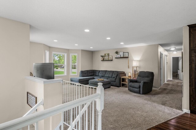 1002 8th Ave N, Princeton, MN 55371 - living room featuring recessed lighting, baseboards, and wood finished floors