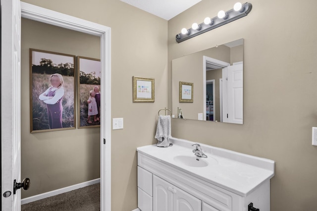 1002 8th Ave N, Princeton, MN 55371 - bathroom with vanity and baseboards