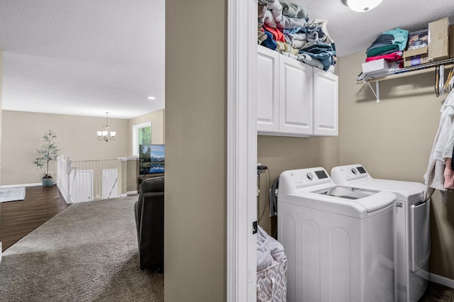 1002 8th Ave N, Princeton, MN 55371 - laundry area with washing machine and clothes dryer, cabinet space, a chandelier, baseboards, and dark wood-style flooring