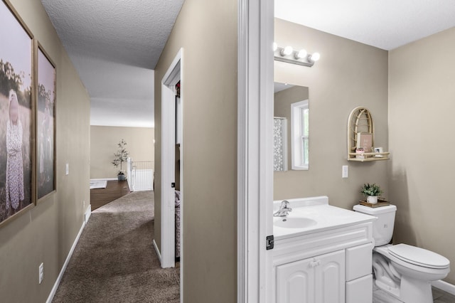 1002 8th Ave N, Princeton, MN 55371 - full bath with toilet, vanity, and baseboards