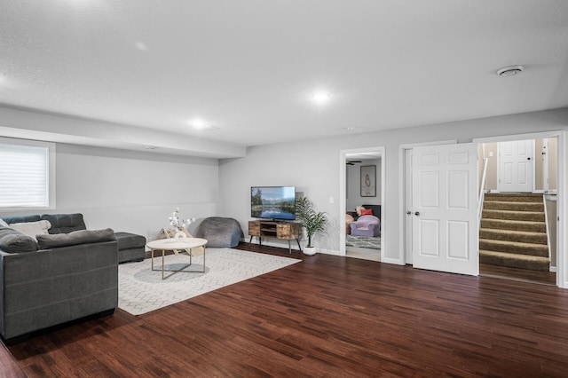 1002 8th Ave N, Princeton, MN 55371 - living room with wood finished floors, stairway, baseboards, and recessed lighting