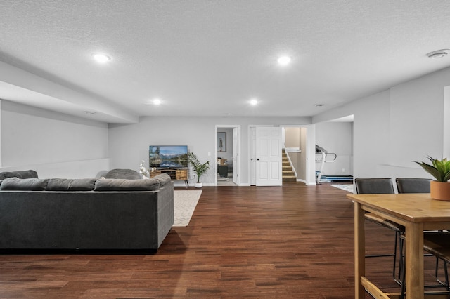 1002 8th Ave N, Princeton, MN 55371 - living area with stairs, wood finished floors, recessed lighting, and a textured ceiling