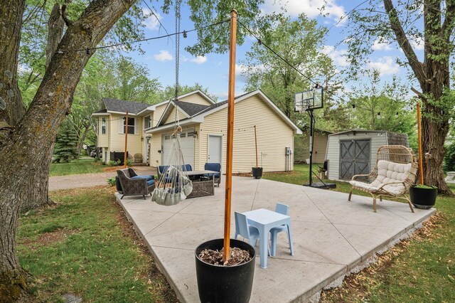 1002 8th Ave N, Princeton, MN 55371 - view of patio / terrace with a garage and concrete driveway