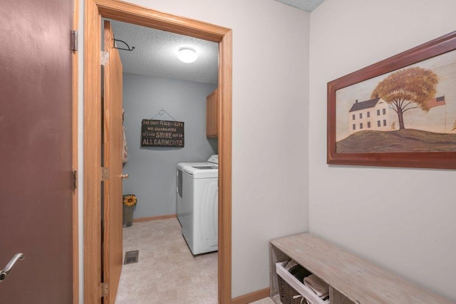 11419 17th St NE, Saint Michael, MN 55376 - laundry area featuring cabinet space, a textured ceiling, independent washer and dryer, light carpet, and baseboards