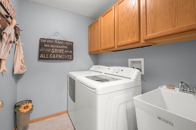 11419 17th St NE, Saint Michael, MN 55376 - laundry area with cabinet space, washing machine and dryer, baseboards, and a textured ceiling