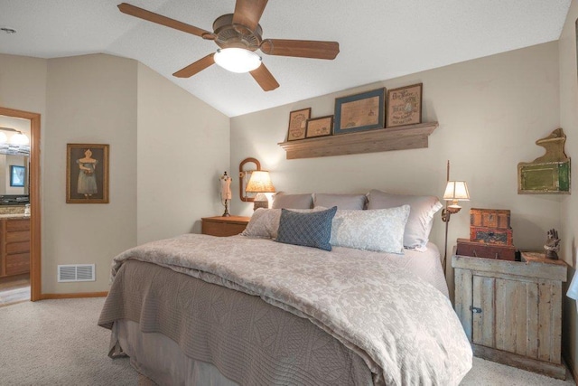 11419 17th St NE, Saint Michael, MN 55376 - bedroom featuring light colored carpet, vaulted ceiling, baseboards, ensuite bath, and ceiling fan