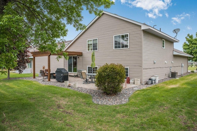 11419 17th St NE, Saint Michael, MN 55376 - rear view of house featuring a lawn, a patio, and central AC