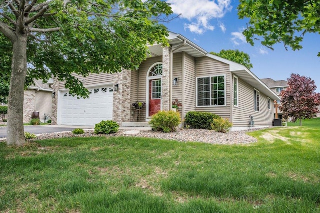 11419 17th St NE, Saint Michael, MN 55376 - view of property hidden behind natural elements featuring driveway, a front lawn, and a garage