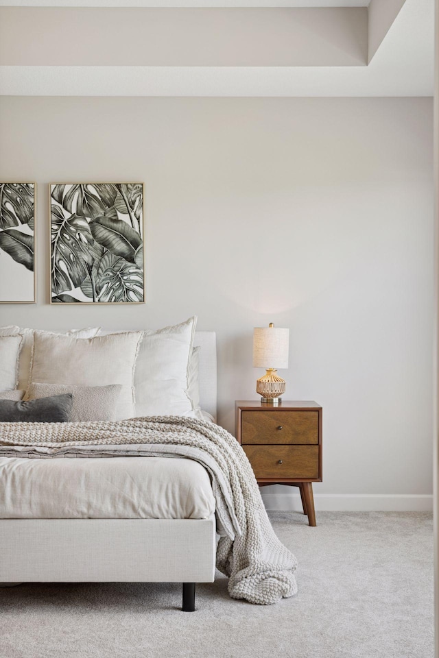 carpeted bedroom with baseboards