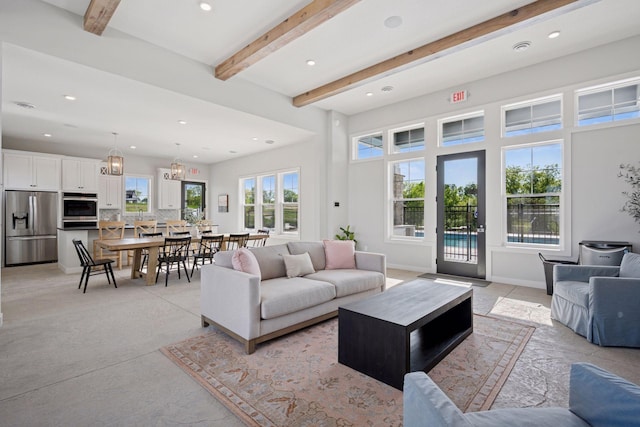 living room featuring recessed lighting and beamed ceiling