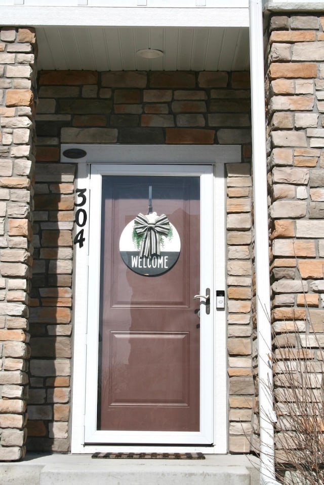 304 Rum River Way, Anoka, MN 55303 - view of exterior entry featuring brick siding