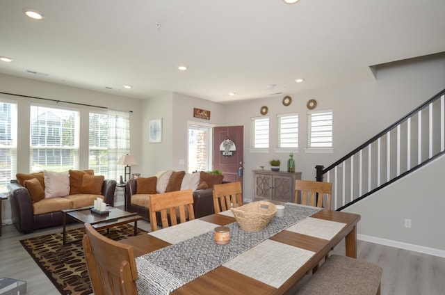304 Rum River Way, Anoka, MN 55303 - dining room with light wood-style floors, recessed lighting, stairway, and baseboards