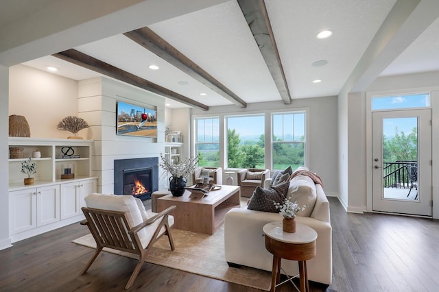 14778 50th St NE, Saint Michael, MN 55376 - living area with a glass covered fireplace, beamed ceiling, dark wood-style flooring, recessed lighting, and baseboards