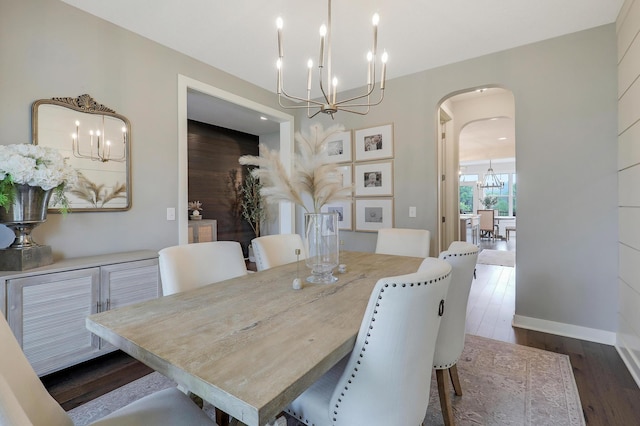 14778 50th St NE, Saint Michael, MN 55376 - dining room with a chandelier, arched walkways, dark wood finished floors, and baseboards