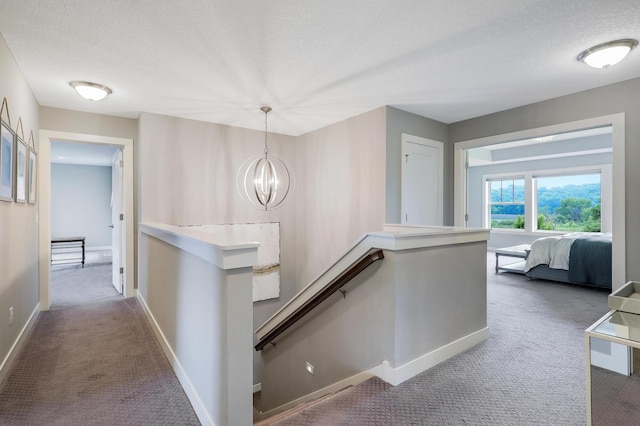 14778 50th St NE, Saint Michael, MN 55376 - hall featuring an upstairs landing, carpet, a chandelier, a textured ceiling, and baseboards