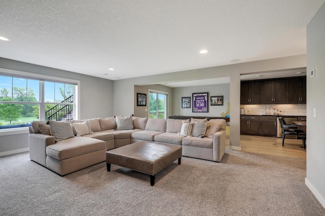 14778 50th St NE, Saint Michael, MN 55376 - living area with light colored carpet, plenty of natural light, recessed lighting, baseboards, and a textured ceiling