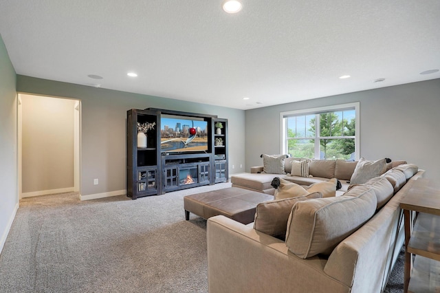 14778 50th St NE, Saint Michael, MN 55376 - carpeted living room featuring a glass covered fireplace, recessed lighting, and baseboards