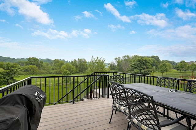 14778 50th St NE, Saint Michael, MN 55376 - wooden deck with outdoor dining area and a grill