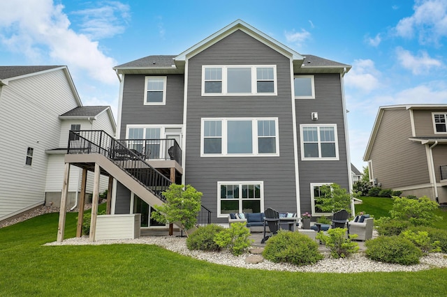 14778 50th St NE, Saint Michael, MN 55376 - rear view of house with a wooden deck, a patio, a lawn, an outdoor hangout area, and stairway