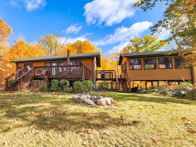 1910 Longwood Point Rd NE, Outing, MN 56662 - back of house with stairs, a deck, and a yard