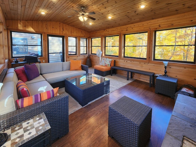 1910 Longwood Point Rd NE, Outing, MN 56662 - living room featuring vaulted ceiling, wood walls, a ceiling fan, wood finished floors, and wood ceiling
