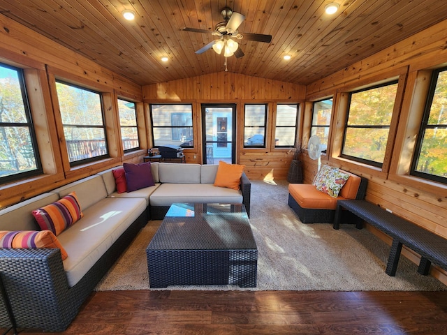 1910 Longwood Point Rd NE, Outing, MN 56662 - living area featuring vaulted ceiling, wood finished floors, wood walls, a ceiling fan, and recessed lighting