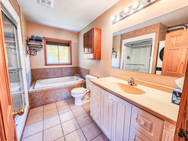 1910 Longwood Point Rd NE, Outing, MN 56662 - bathroom with tile patterned floors, a bath, toilet, vanity, and a shower with shower door