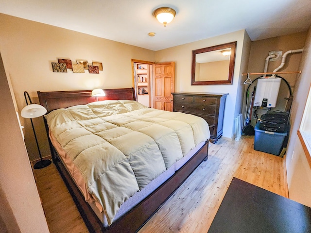 1910 Longwood Point Rd NE, Outing, MN 56662 - bedroom featuring water heater and light wood-type flooring